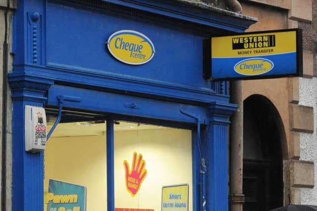 Cheque Centre closed its remaining high street branches last year. Picture: Neil Hanna