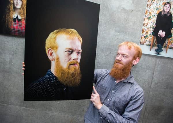 Colin Cummings with his portrait. Picture: Paul Campbell/Contributed