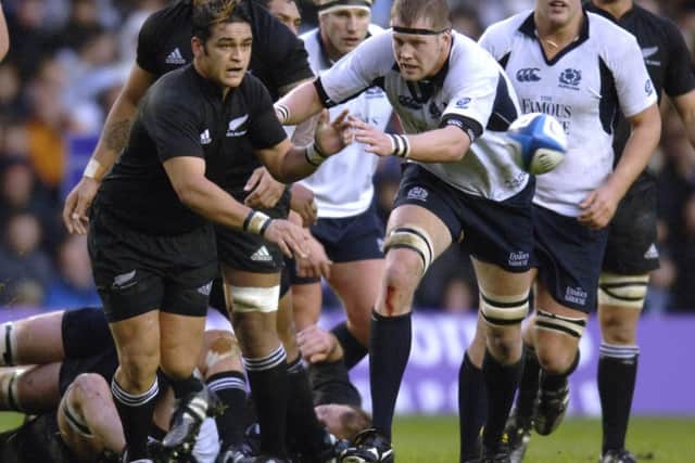 Craig Hamilton gets after New Zealand scrum-half Piri Weepu at Murrayfield in 2005. Picture: Ian Rutherford
