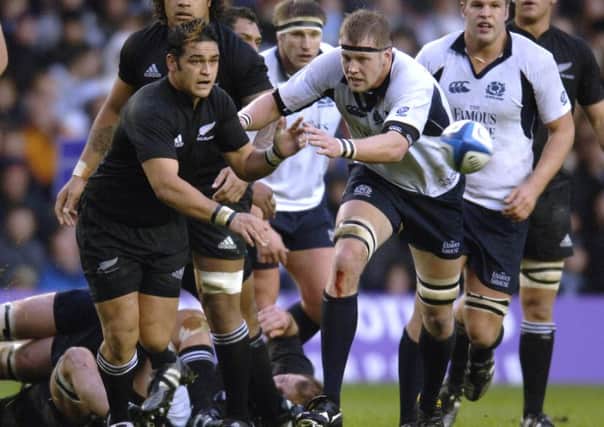 Craig Hamilton gets after New Zealand scrum-half Piri Weepu at Murrayfield in 2005. Picture: Ian Rutherford