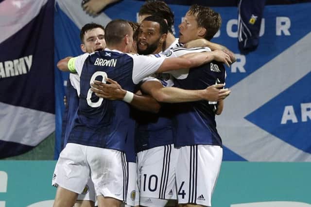 Scotland players celebrate after scoring against Lithuani. Picture: AP Photo/Mindaugas Kulbis