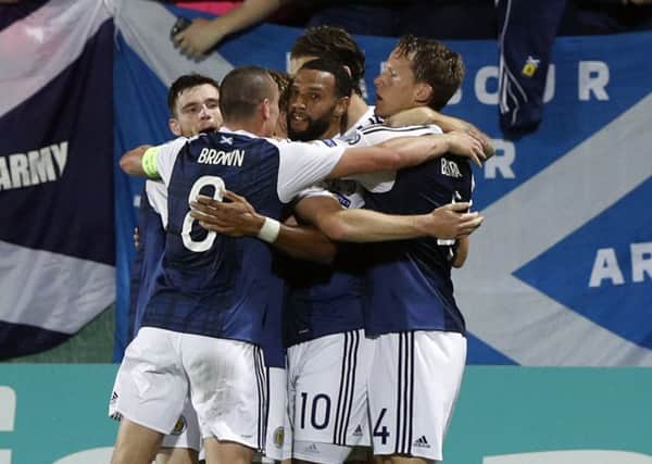 Scotland players celebrate after scoring against Lithuani. Picture: AP Photo/Mindaugas Kulbis