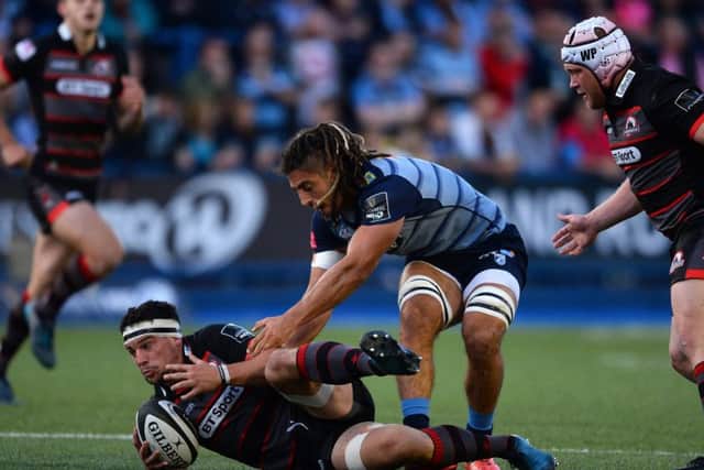 John Hardie of Edinburgh is tackled by Josh Navidi of Cardiff Blues during the visitors' 20-10 victory at Cardiff Arms Park. Picture: Getty Images