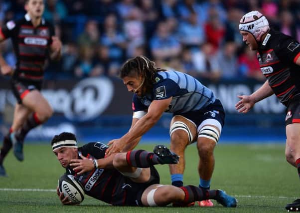 John Hardie of Edinburgh is tackled by Josh Navidi of Cardiff Blues during the visitors' 20-10 victory at Cardiff Arms Park. Picture: Getty Images