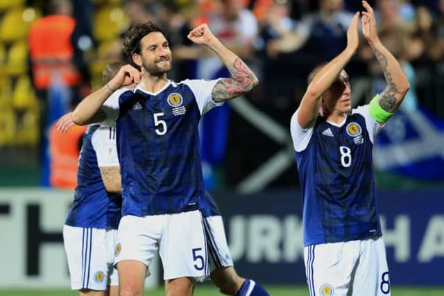 Scotland's Charlie Mulgrew and Scott Brown celebrate the 3-0 win over Lithuania in Vilnius. Picture: Adam Davy/PA Wire