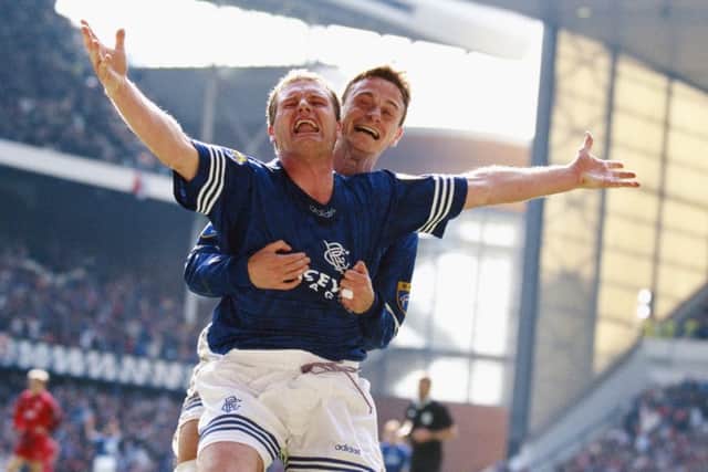 Paul Gascoigne celebrates a goal with Davie Robertson during the Scottish Premier League match between Rangers and Aberdeen. Picture: Ben Radford/Getty Images
