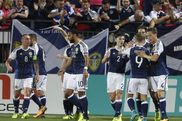 Scotland celebrate atfer netting in Lithuania. Picture: AP Photo/Mindaugas Kulbis
