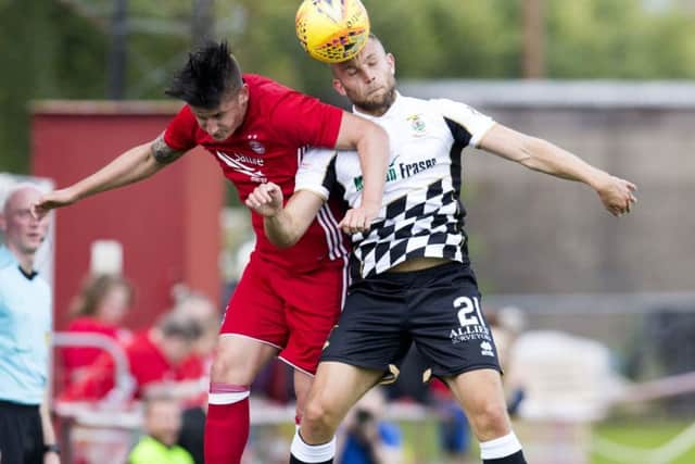 Aberdeen Colt's Toby Wells in action against Alex Cooper. Picture: SNS/Bruce White