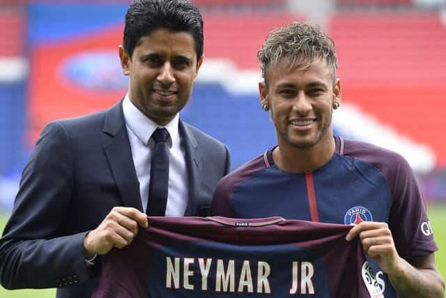 Neymar with Paris Saint-Germain president Nasser Al-Khelaifi after his world-record transfer. Photograph:Aurelien Meunier/Getty Images