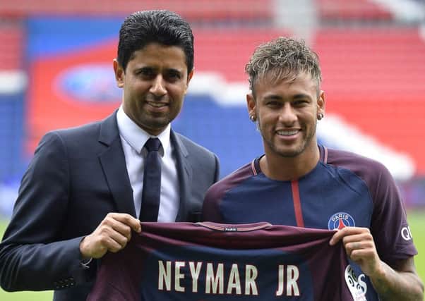 Neymar with Paris Saint-Germain president Nasser Al-Khelaifi after his world-record transfer.  Photograph:Aurelien Meunier/Getty Images