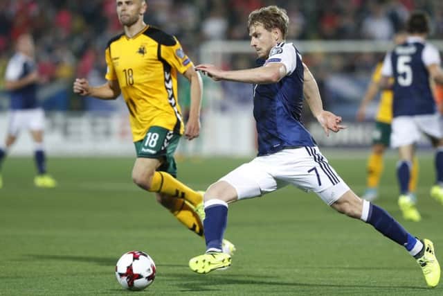 The impressive Stuart Armstrong skips past Lithuanias Arturas Zulpa during Friday nights comfortable 3-0 World Cup qualifying win in Vilnius.
Photograph: Mindaugas Kulbis/AP