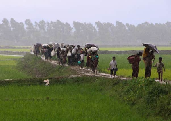 Rohingya refugees from Rakhine state in Myanmar flee fighting.
 Picture: SUZAUDDIN RUBEL/AFP/Getty Images
