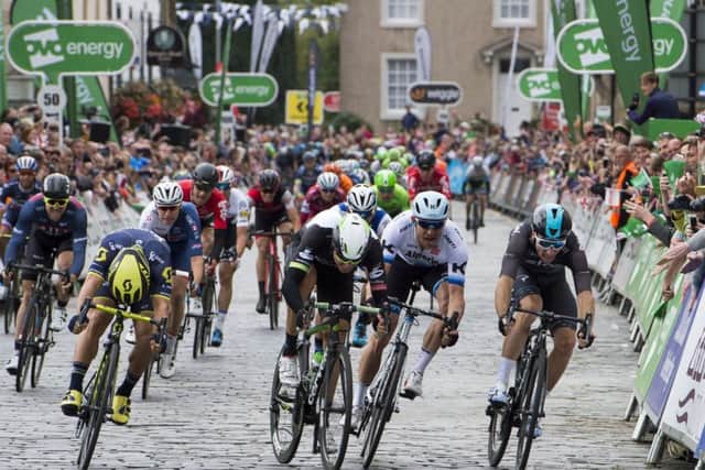 Caleb Ewan, far left, just gets to the line ahead of his rivals in Kelso to win the first stage of the Tour of Britain. Picture: PA.