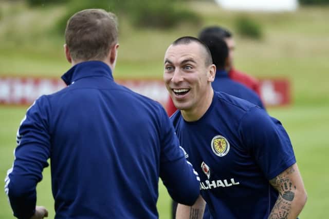 Scotland's Scott Brown shares a laugh with team-mate Leigh Griffiths. Picture: SNS/Rob Casey