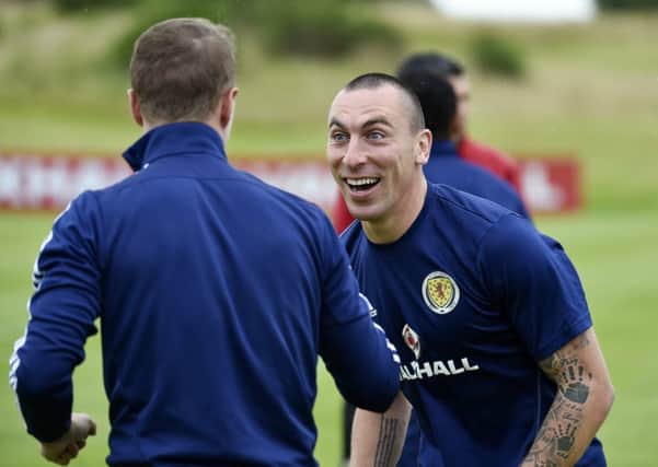 Scotland's Scott Brown shares a laugh with team-mate Leigh Griffiths. Picture: SNS/Rob Casey