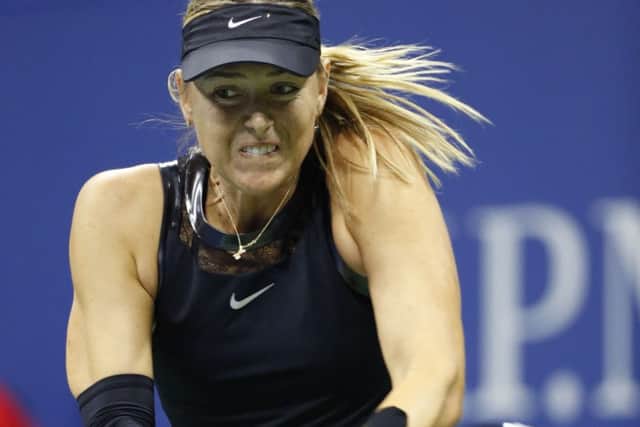 Maria Sharapova feels the strain on her way to a 5-7, 6-4, 6-2 defeat by Anastaija Sevastov. Picture: AP.