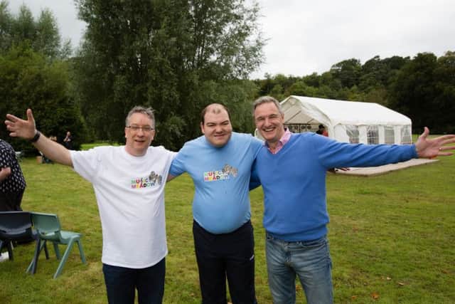 Catrine Bank staff member Kevin Fullerton, resident Murray Robertson and Mark Lever, chief executive of The National Autistic Society  (Picture: Martin Shields)