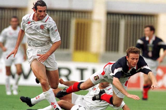 Kevin Gallacher comes in for some tough treatment during the clash with Malta in 1997. Picture: Alan Harvey/Contributed