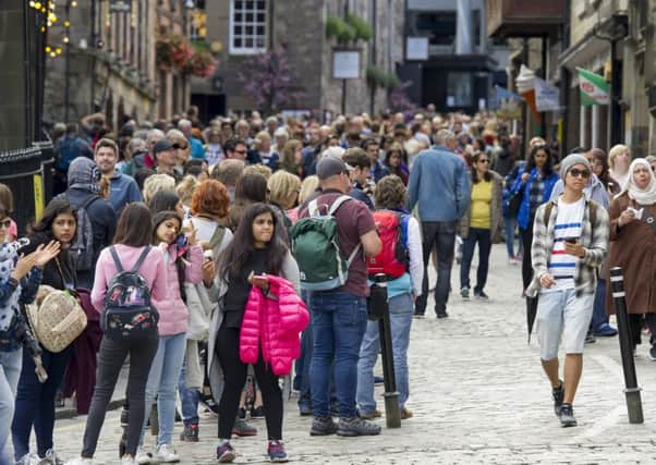 Tourists on the Royal Mile during the Edinburgh Festival. Picture: Ian Rutherford