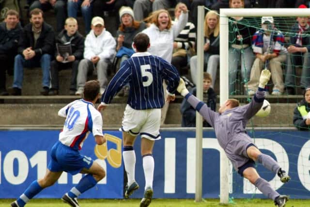 John Peterson puts the Faroe Islands 2-0 up against Scotland in Toftir in September 2002. Picture: SNS Group