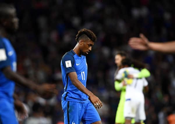 Dejected French forward Kingsley Coman leaves the field after his side had been held to a shock goalless draw by Luxembourg. Picture: AFP/Getty