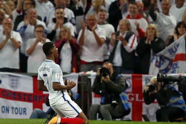 England's striker Marcus Rashford celebrates scoring England's second goal against Slovakia. Picture: ADRIAN DENNIS/AFP/Getty Images
