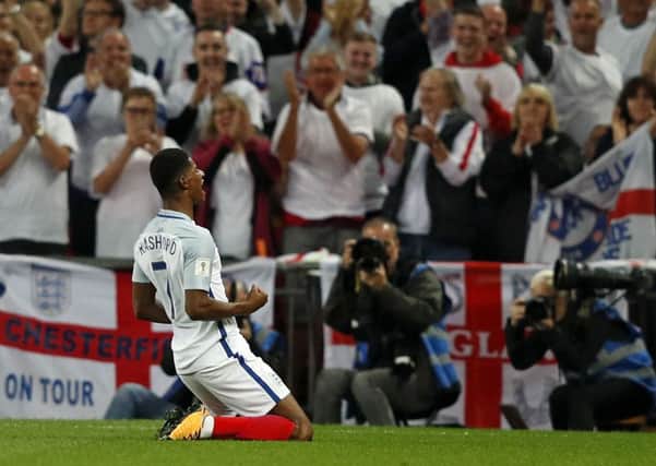 England's striker Marcus Rashford celebrates scoring England's second goal against Slovakia. Picture: ADRIAN DENNIS/AFP/Getty Images