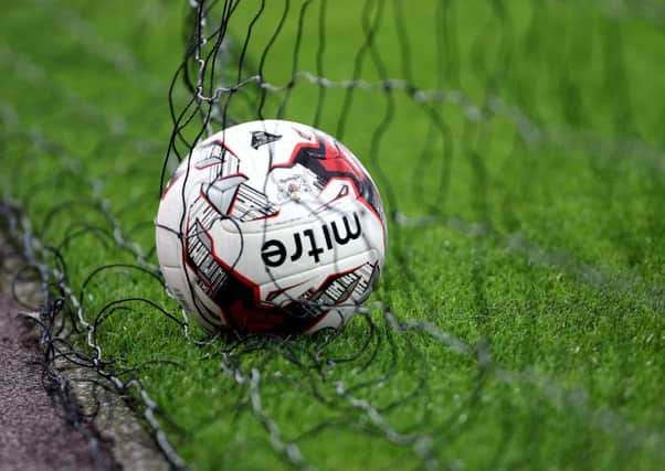 MSPs will quiz football association bosses on progress to improve child protection in the sport. Picture: PA