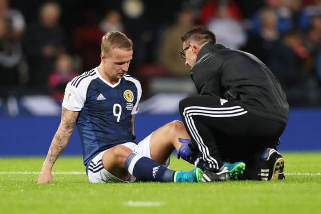 Leigh Griffiths receives treatment during the 2-0 victory over Malta. Picture: Getty Images