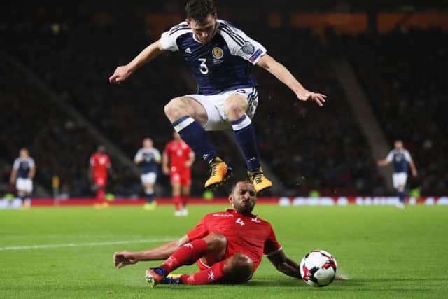 Andy Robertson attempts to ride a tackle from Borg at Hampden last night. Picture: Getty Images