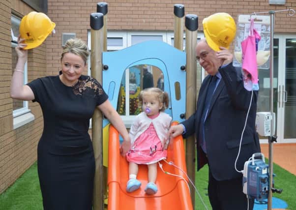 New ARCHIE chair Mary Nimmo and outgoing chairman David Sutherland launch the new Fresh Air Project at Raigmore Hospital with the help of childrens unit patient Ella Rose Sinclair, three. Picture: Contributed