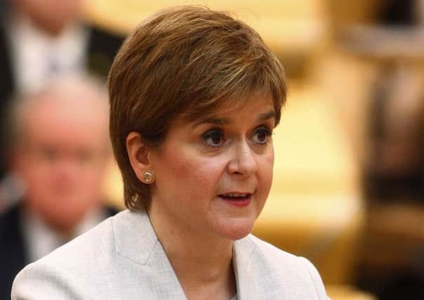 Nicola Sturgeon has stood by former minister Mark McDonald. Picture: Andrew Cowan/PA