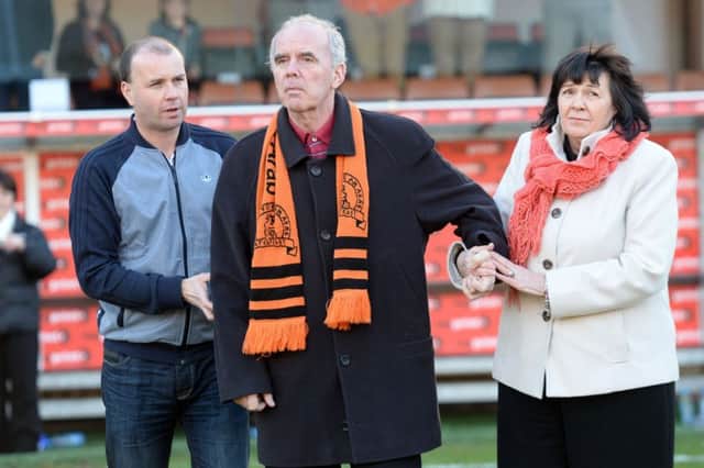 Frank Kopel and wife Amanda made an appearance on the pitch during a Dundee United match in 2014. Picture: SNS Group