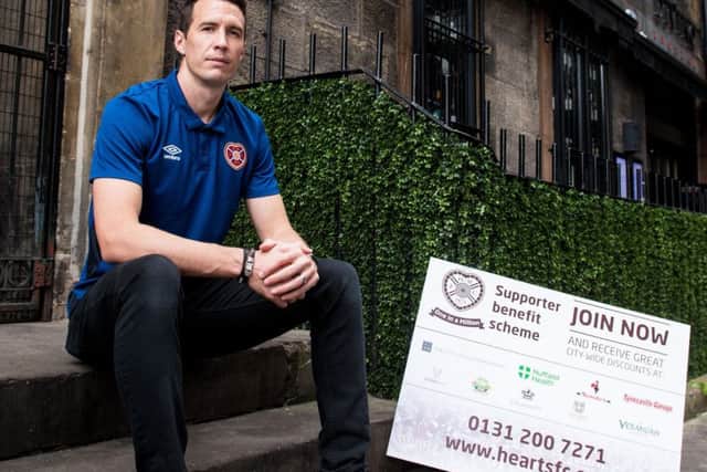 Hearts keeper Jon McLaughlin promotes the launch of supporter benefit scheme, One in a Million. Picture: SNS