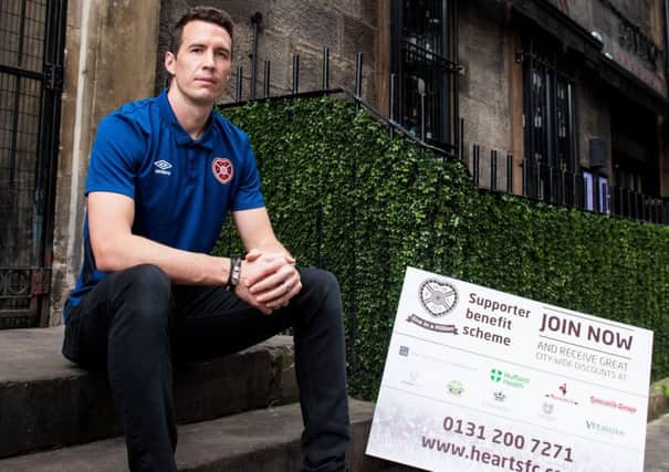 Hearts keeper Jon McLaughlin promotes the launch of supporter benefit scheme, One in a Million. Picture: SNS