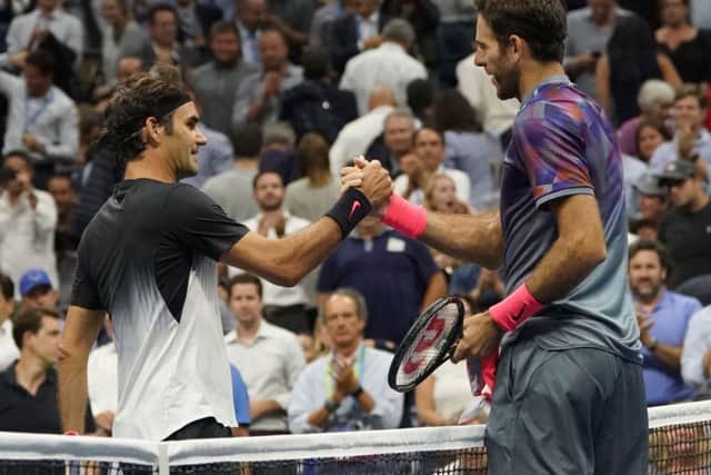 Federer congratulates Del Potro after the Argentinian's victory. The Swiss ace conceded that Del Potro deserved it more. Picture: AFP/Getty Images