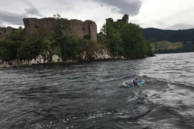 Ian swimming past Urquhart Castle on Loch Ness. Picture: Contributed