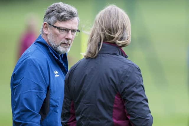 Hearts manager Craig Levein, left, talks to his assistant Austin MacPhee during training. Picture: SNS