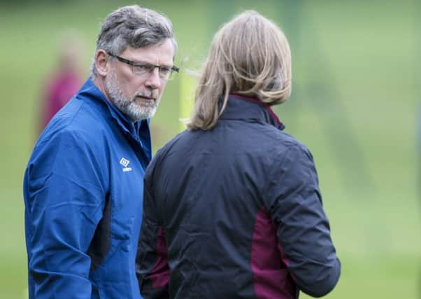 Hearts manager Craig Levein, left, talks to his assistant Austin MacPhee during training. Picture: SNS