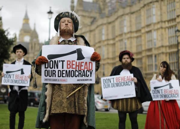Protesters dressed in Tudor costume including one dressed as King Henry VIII hold signs protesting elements of the European Union Withdrawl Bill. Pic: Getty Images