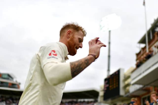 England's Ben Stokes acknowledges the Lord's crowd as he leaves the field after taking six wickets on the first day of the third Test. Picture: Getty Images