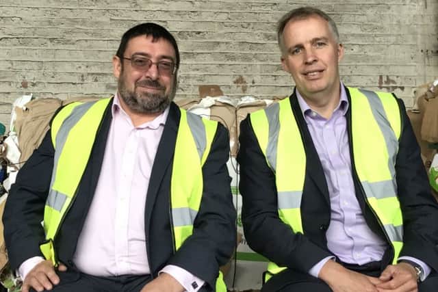 Ace Recycling's Malcolm Mcardle, left, with Spotless chief Roger Green. Picture: Contributed