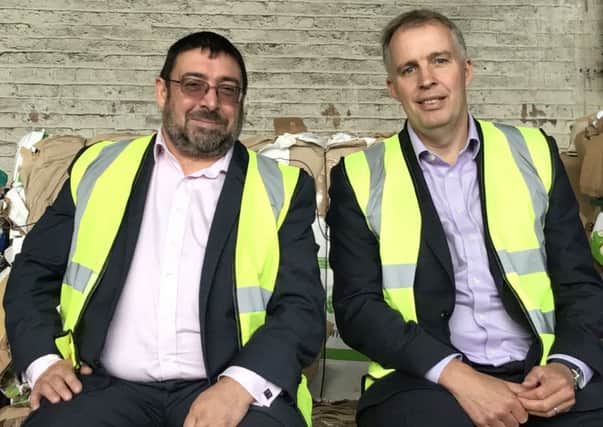 Ace Recycling's Malcolm Mcardle, left, with Spotless chief Roger Green. Picture: Contributed