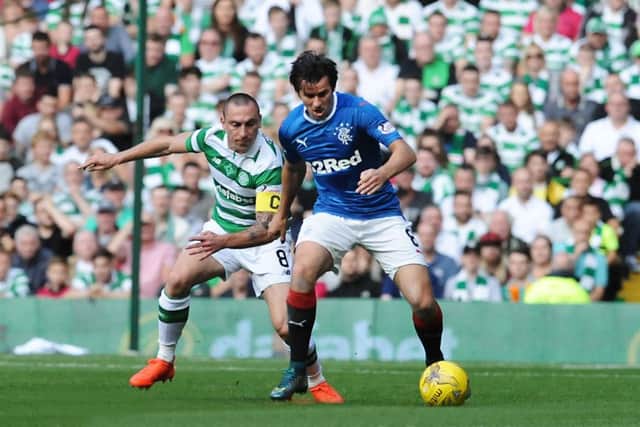 Brown got the better of Joey Barton in the first Old Firm match of last season. Picture: John Devlin