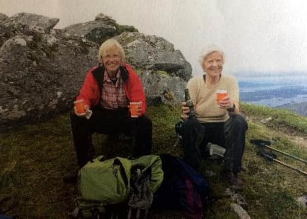 Elsa Yates, on the right, on her last set of Munros on A'Mhaighdean with a friend.