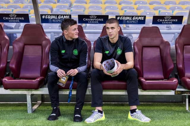 Liam Henderson, left, has a watching brief at Celtics Champions League play-off tie in Astana last month. Picture: SNS.