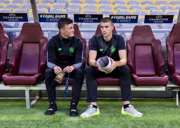 Liam Henderson, left, has a watching brief at Celtics Champions League play-off tie in Astana last month. Picture: SNS.
