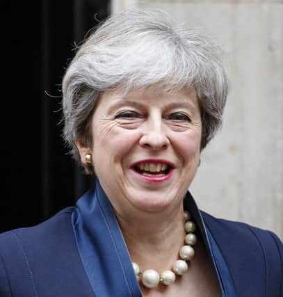 Theresa May has spoken out about abuse in politics / AFP PHOTO / Tolga AKMENTOLGA AKMEN/AFP/Getty Images