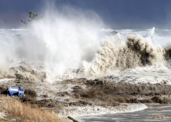 A tsunami was believed to have hit Britain in the 11th century causing destruction. Picture: SADATSUGU TOMIZAWA/AFP/Getty Images
