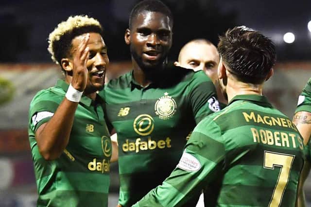 Celtic's Scott Sinclair, left, celebrates his second goal with Odsonne Edouard and Patrick Roberts. Picture: SNS